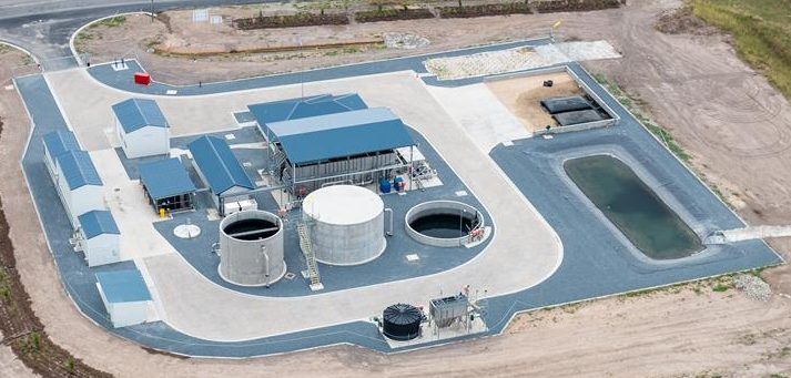 Aerial view of the Marian water treatment plant showing its tanks, buildings and lagoon