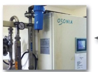 Ozonia ozone generator cabinet with pipework and a pressure gauge, used for disinfection