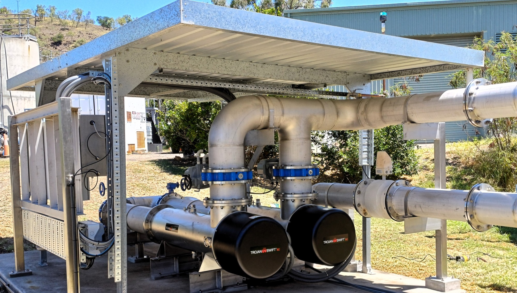 Two Trojan UV Swift D12 reactors and stainless pipework under a shelter at Gayndah