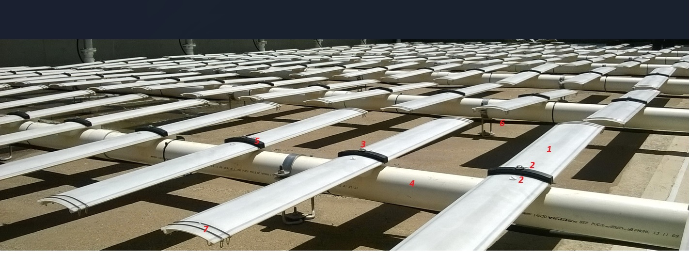 Rows of Aquablade fine bubble diffusers in an empty basin, with numbered feature markers